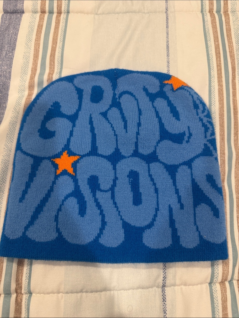 Blue Knit Beanie with Orange Star and Spiderweb Accents